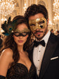 Gold & Black Couples Masquerade Mask Set | Gold Checkered Venetian Mask for Men and Black Gold Lace Mask with Peacock Feathers for Women